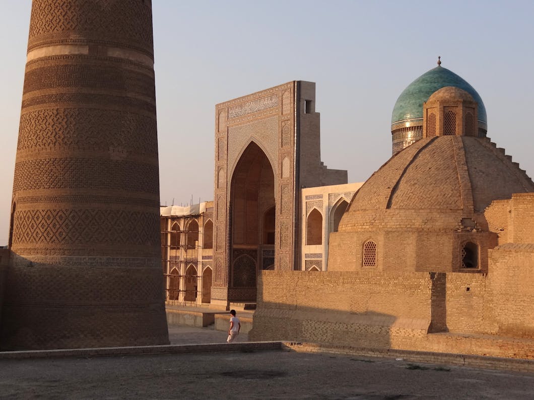 Mir-i-Arab Medressa with Column of Kalon Minaret at Left - Old City - Bukhara - Uzbekistan